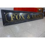 A large painted pub sign, Fox and Grapes, 290cms x 48cms