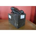 An erotic female bronze sculpture on marble base, 15cms h.