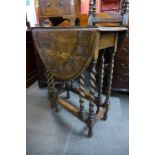 A carved oak barleytwist gateleg table