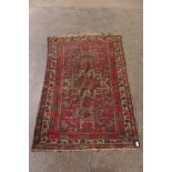 An eastern red and green rug