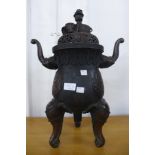 An oriental bronze two handled koro and cover, 51cms h