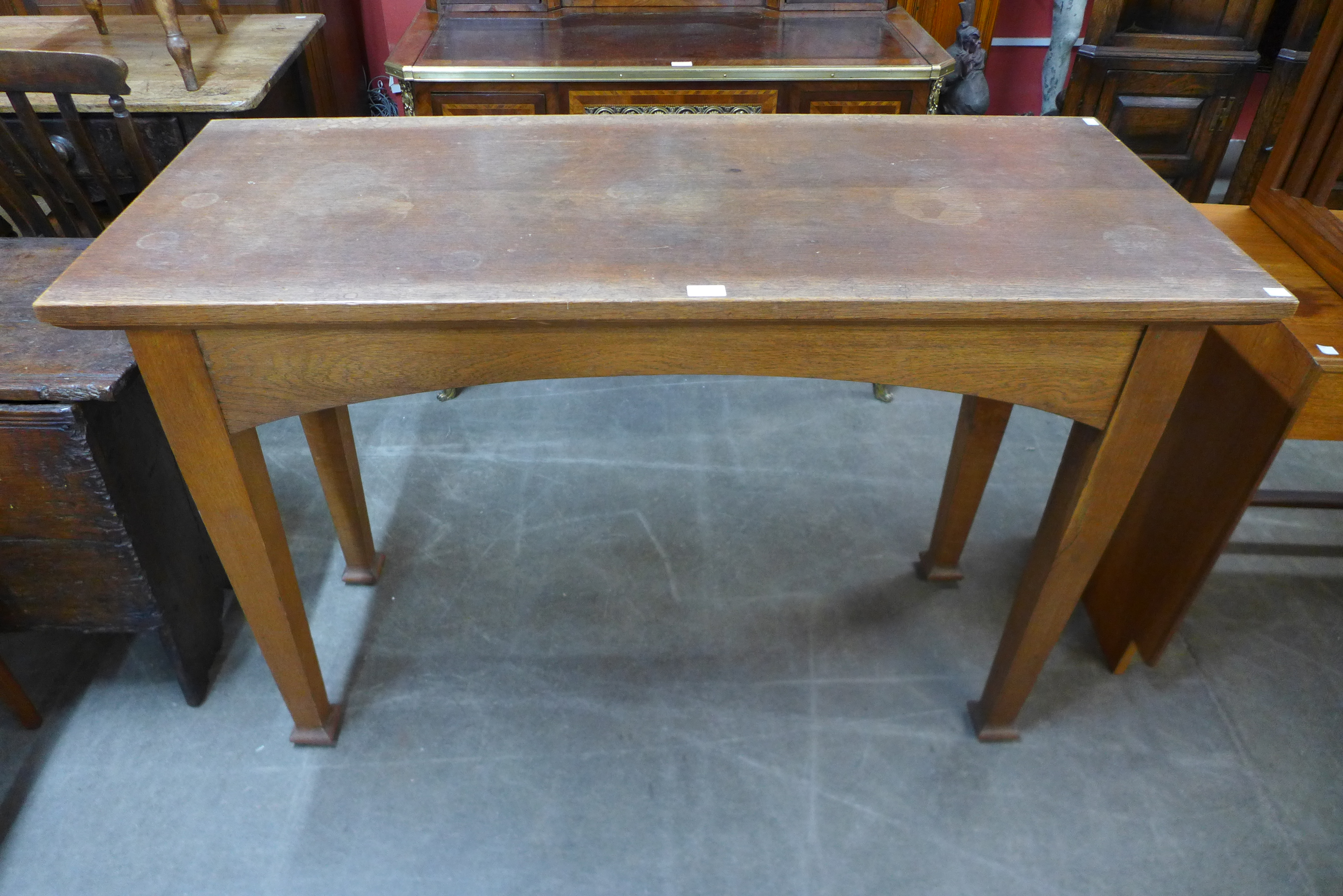 An Arts and Crafts oak altar table, 86cms h, 130cms L, 53cms w.