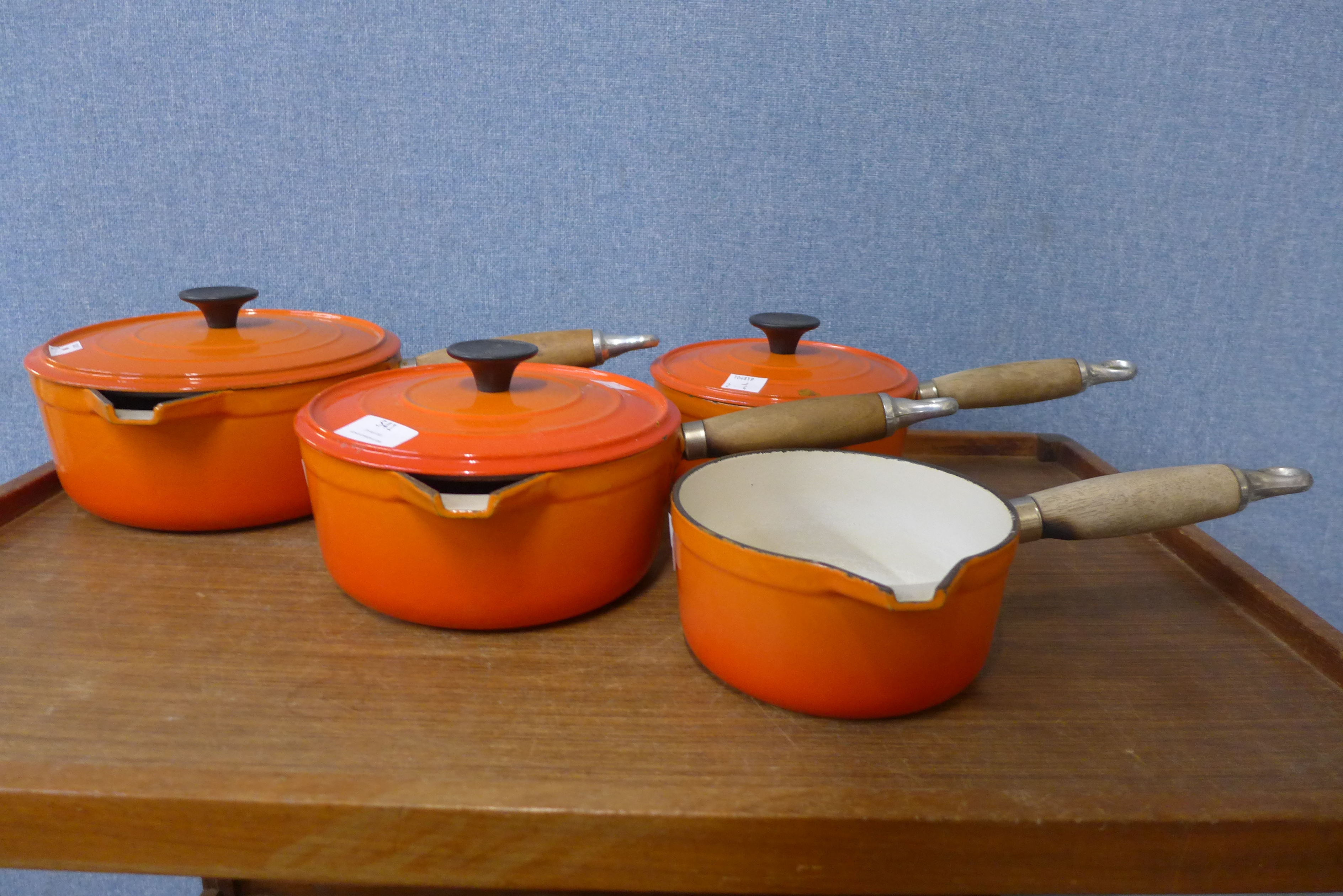 A set of four French Cousances cast iron and enamelled saucepans