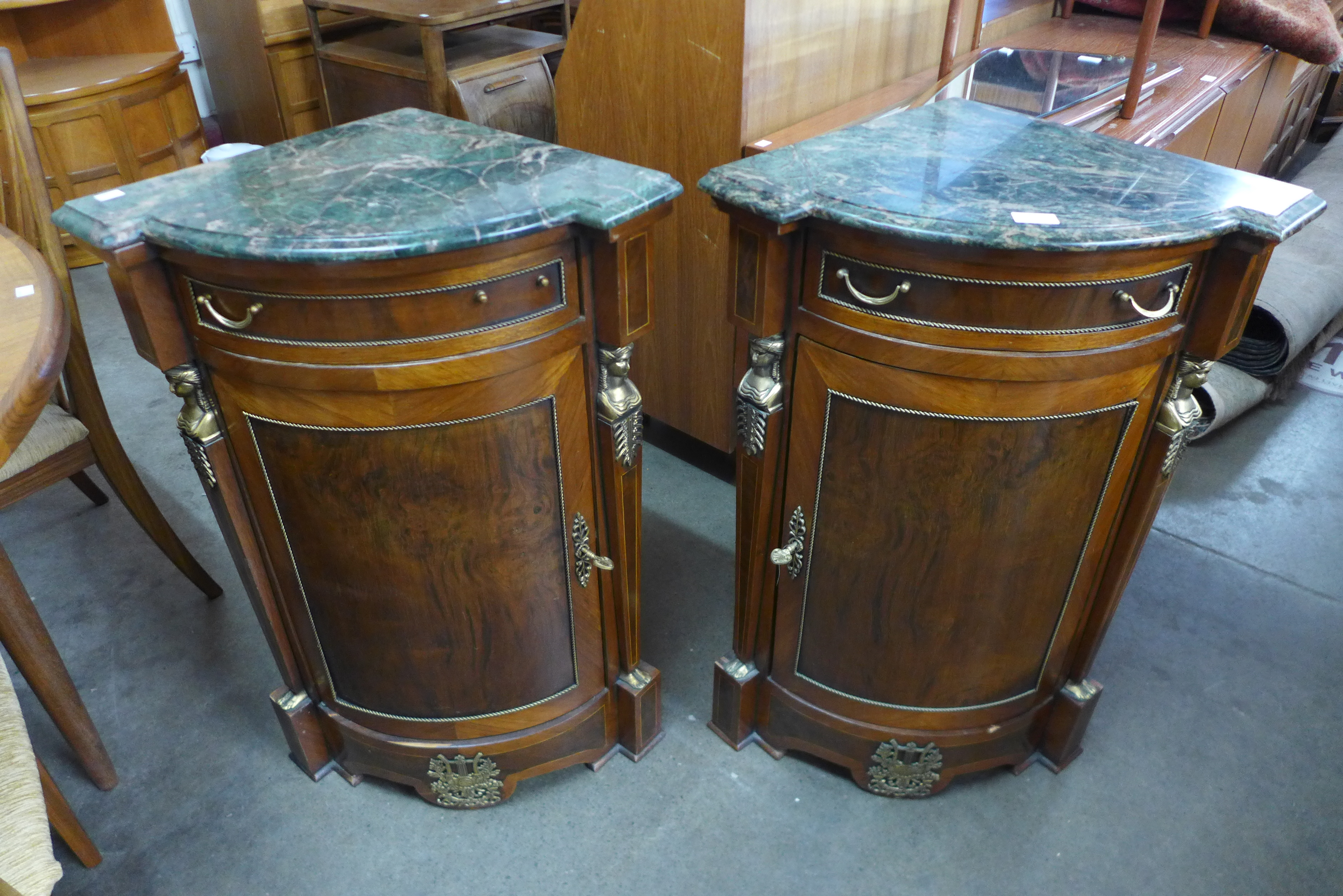 A pair of French Egyptian Revival mahogany, walnut, gilt metal and marble topped ecoignures, 85cms