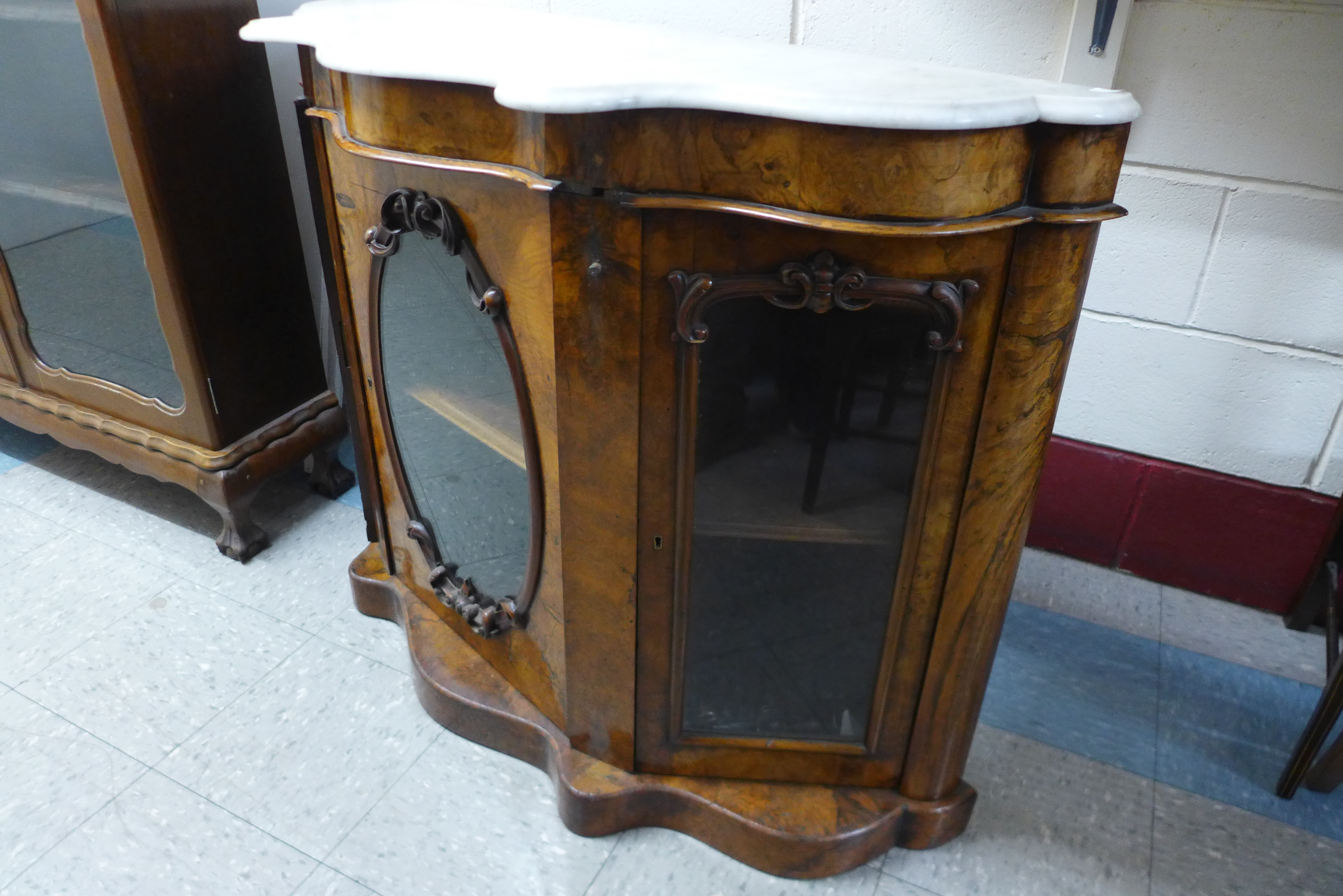 A Victorian walnut and marble topped serpentine credenza, 88cms h, 122cms w, 41cms d. - Image 3 of 3