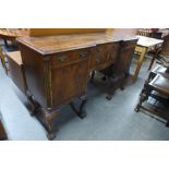 A Queen Anne style mahogany breakfront sideboard