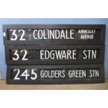 Three painted wooden street signs