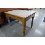 A pine single drawer kitchen table