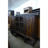 An early 20th Century oak barleytwist bookcase, 135cms h, 154cms w, 42cms d.