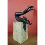 An erotic female bronze sculpture on marble base, 27cms h.