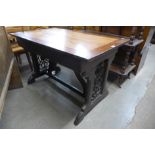 A Victorian Gothic Revival oak library table (later top), 72cms h ,116cms w, 69cms d