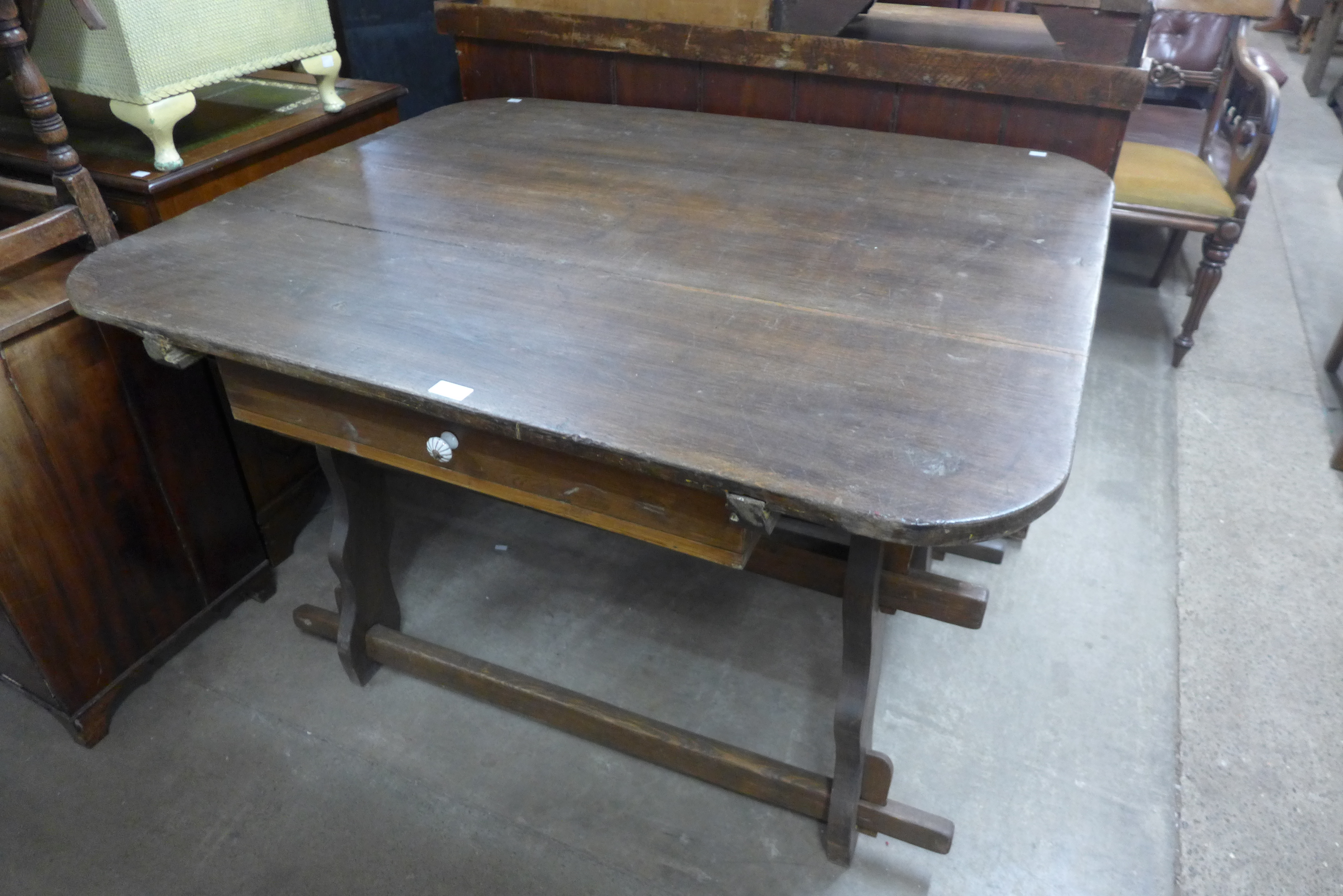 A French provincial elm kitchen table