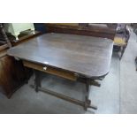 A French provincial elm kitchen table