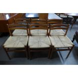 A set of six Danish teak and cord seated dining chairs