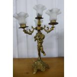 A gilt metal cherub table lamp