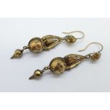 A pair of early 20th Century yellow metal pendant earrings, 4.8g