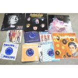 A collection of LP records and 7" single records including The Rolling Stones, The Beatles, The