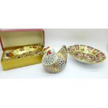 A Royal Crown Derby 1128 pattern pin dish, one other 1128 pattern dish and an Imari hen paperweight