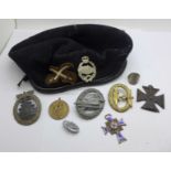 Three German WWII period badges, two lacking hooks, a 1936 tinnie badge, a mothers cross medal, a/f,