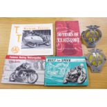 Motorcycling books and two AA badges