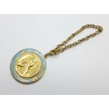 A 9ct gold and enamelled St. Christopher on a short 9ct gold chain, total weight 20.3g, bears