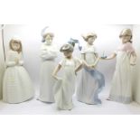 One Lladro and four Nao by Lladro figurines, 'It's Morning Already' (Lladro ref. 6483), 'How Pretty'