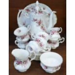 A Royal Albert Lavender Rose six setting coffee set, one saucer repaired