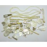 Mother of pearl gaming counters, three necklets, four spoons, two pendants, etc., some a/f for