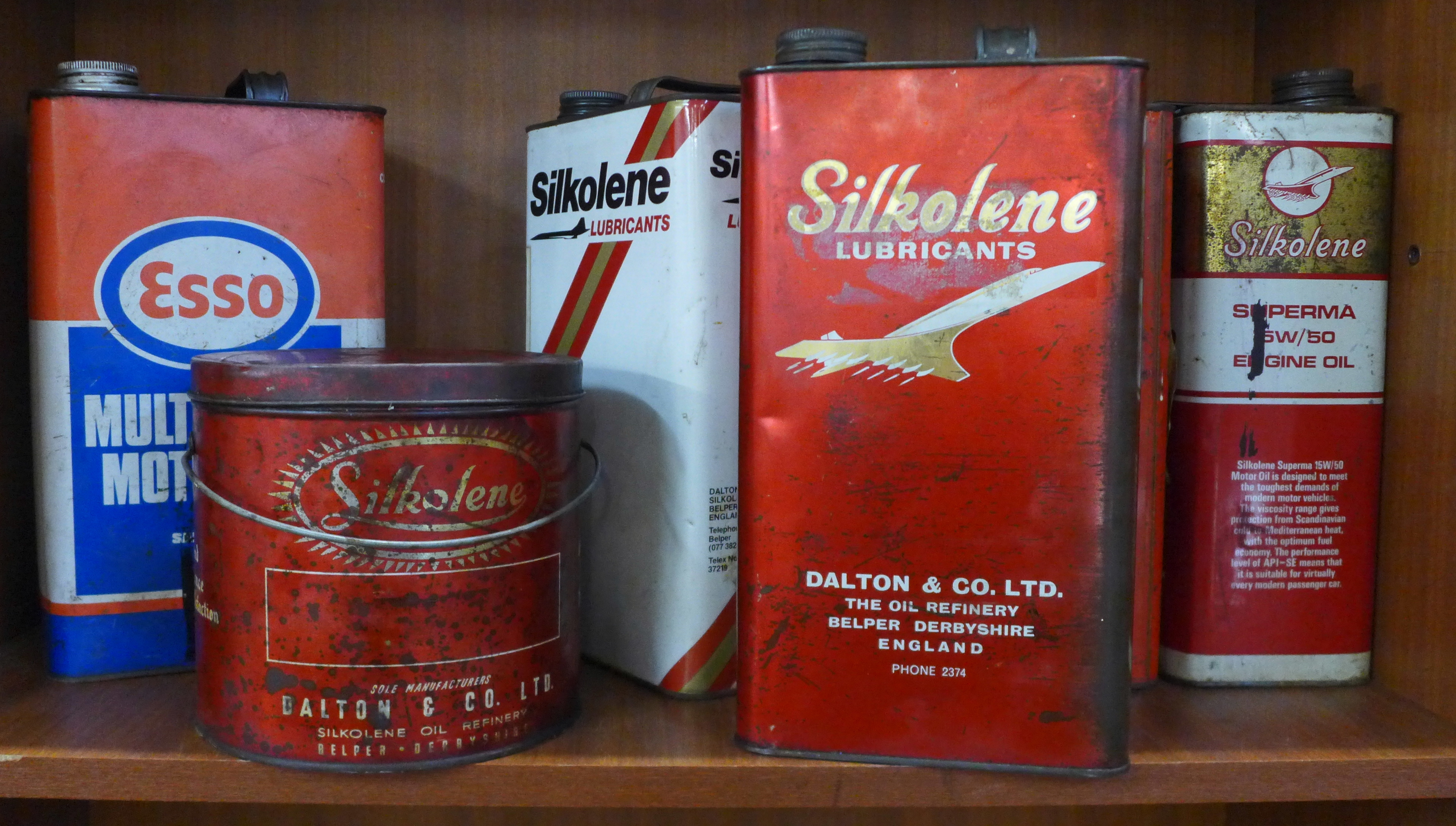 Six oil cans, Silkolene Lubricants and Esso