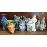 A set of three graduated ironstone chinoiserie jugs, two Chinese vases, a Royal Worcester figure