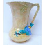 A large Burleigh Ware jug decorated with a kingfisher, small paint loss to wing and tail feathers,