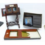 A mahogany lantern slide viewer, with slide carrier and a collection of slides, the viewer marked