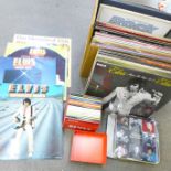 Elvis, a collection of LP records, CD singles box set and a tin with book and nine magnet set