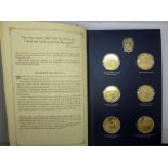 A folder of The Churchill Centenary Medals, minted by John Pinches Medallists Ltd., twenty-four