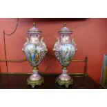 A pair of large French style pink porcelain and gilt metal mounted vases and covers, with gilded