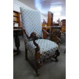 A French carved walnut and upholstered fauteuil