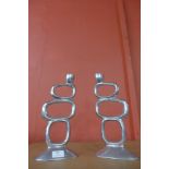 A pair of mid 20th Century aluminium candle holders