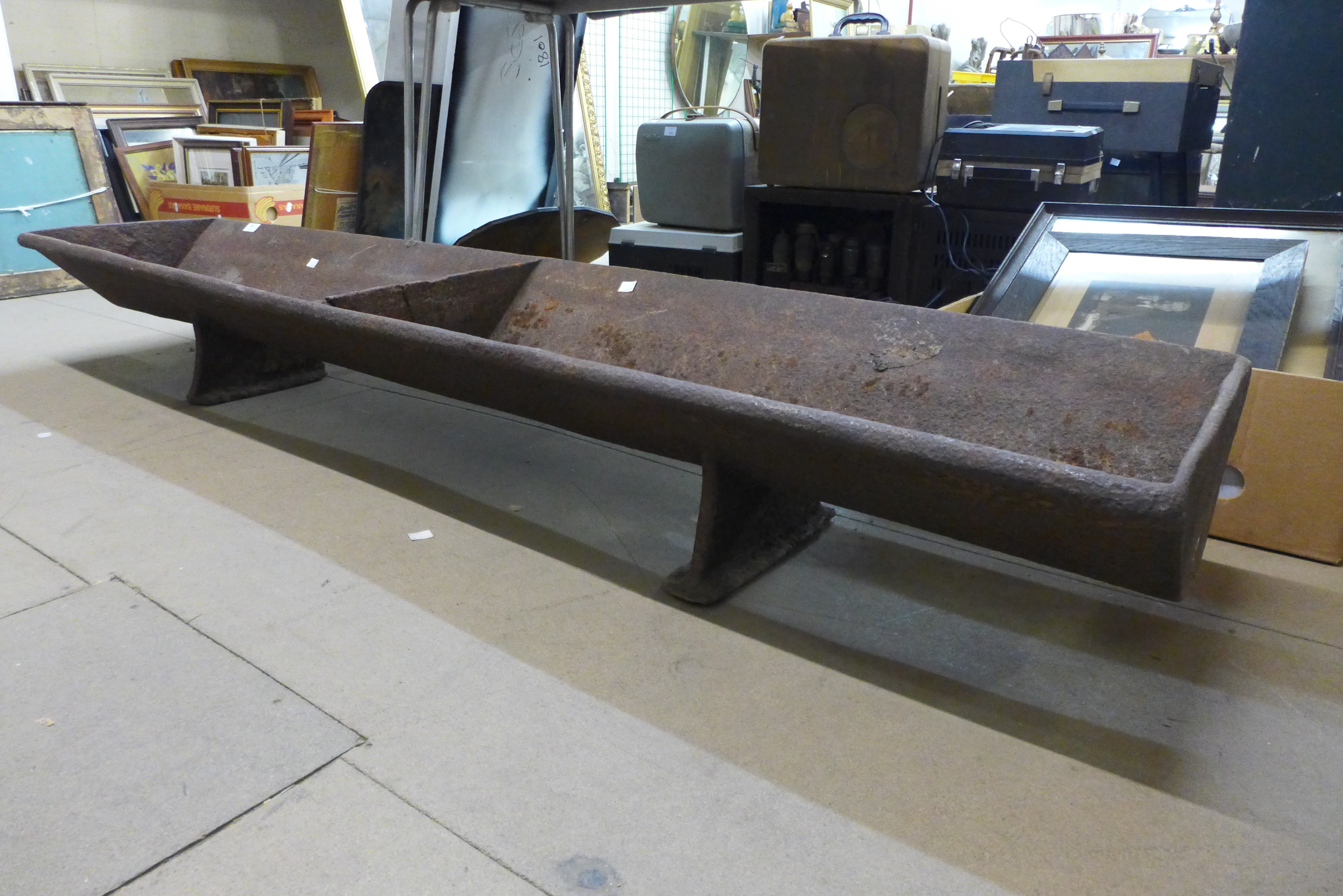 A large cast iron feeding trough, 177 x 38cm