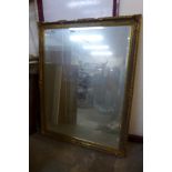 A large gilt framed mirror