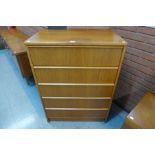 A teak chest of drawers