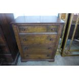 A carved Ipswich oak chest of drawers