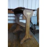 An Arts and Crafts inlaid oak occasional table, attributed to Liberty & Co.