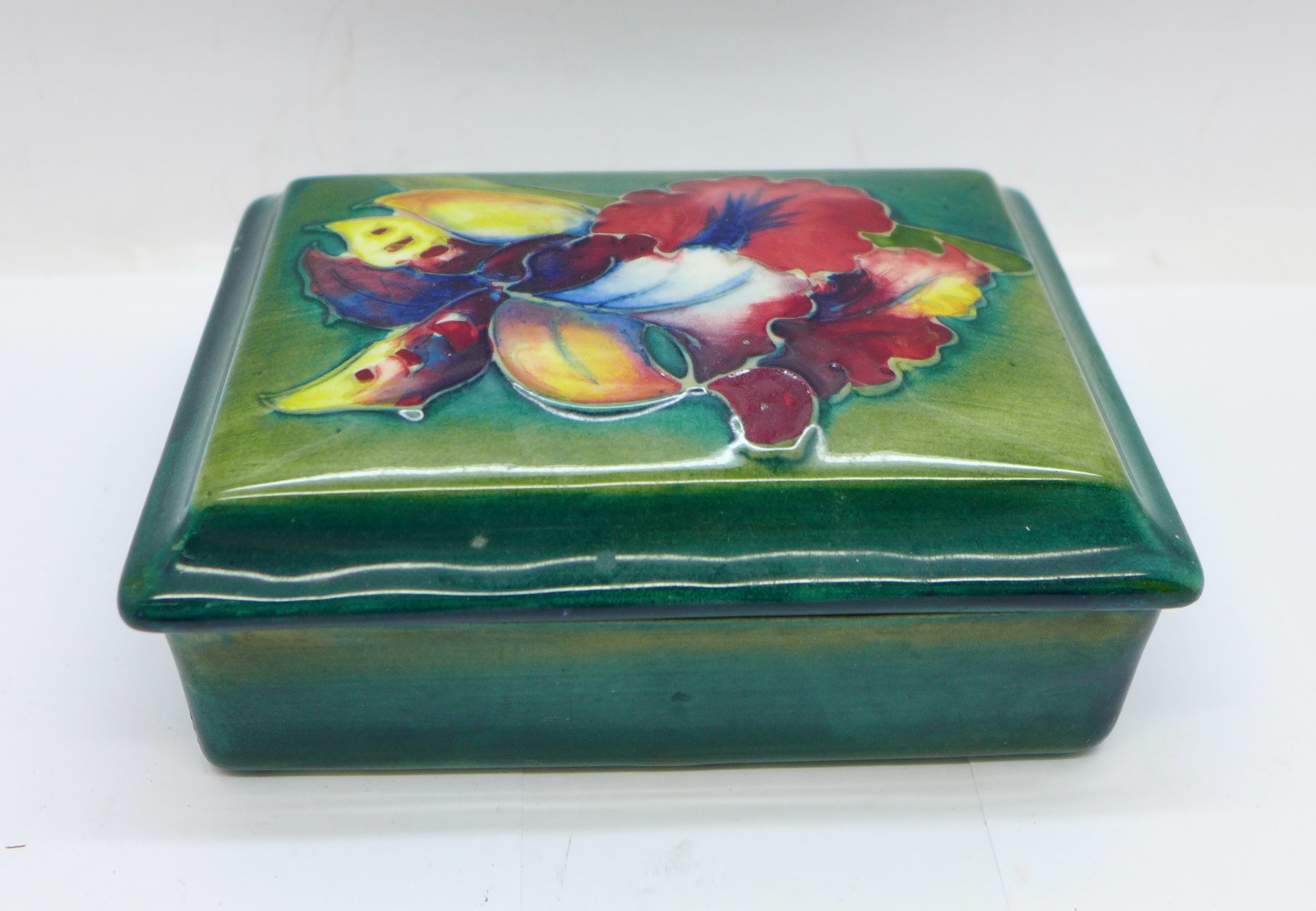 A Moorcroft trinket box and cover, signed W Moorcroft to the base and lid, 12cm x 9cm