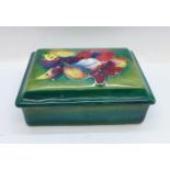A Moorcroft trinket box and cover, signed W Moorcroft to the base and lid, 12cm x 9cm