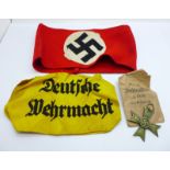 A German WWII period factory workers armband, a Third Reich armband and a German cross medal, with