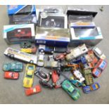 A collection of boxed and loose die-cast model vehicles