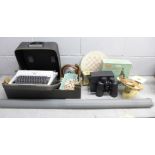 An Olympia Monica typewriter, a Merit microscope set, a pair of 10x50 binoculars, an Estyma quartz