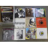 A collection of seventy-four 7" vinyl singles, all 1980's new wave, Elvis Costello, Pretenders,