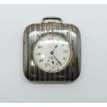 A silver travel clock, the dial marked Calvalry Surprise, glass a/f, case lacking some inlay