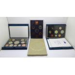 Three Royal Mint proof sets:- 1976, 1994 including the Special Bank of England £2 and D-Day 50p coin